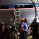 Emergency workers search for the injured after an Amtrak passenger train carrying more than 200 passengers from Washington, D.C., to New York City derailed May 12, 2015, in North Philadelphia. At least seven people were killed and more than 50 others were injured in the crash.
Mark Makela/Getty Images